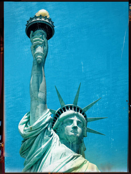 istock Statue of liberty closeup against clear blue sky 967903006