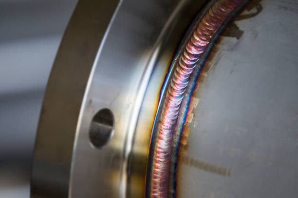 steel weld joined pipe to plate by arc welding process . rainbow color.with copy space - soldar imagens e fotografias de stock