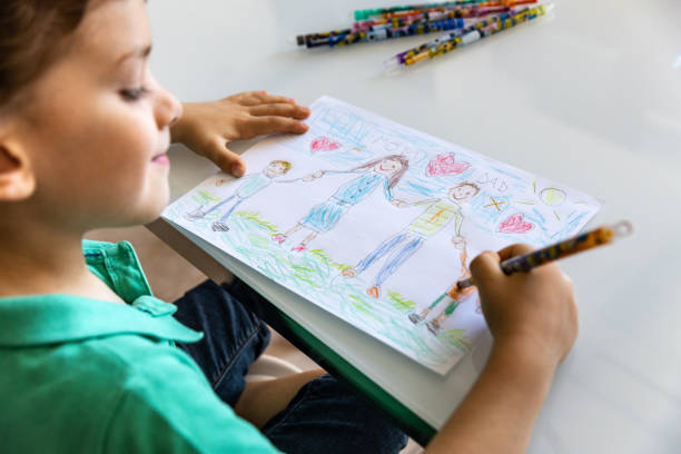 istock Happy drawings with family at home 967906588