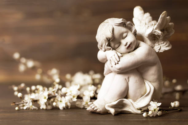 istock Angel guardian and spring flowers 967906968