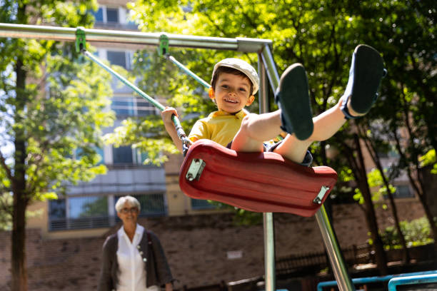 istock Happy kids playing outdoor at the park 967909352