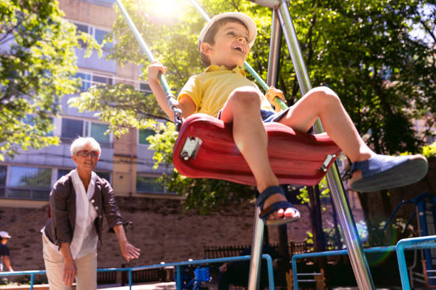 istock Happy kids playing outdoor at the park 967909366