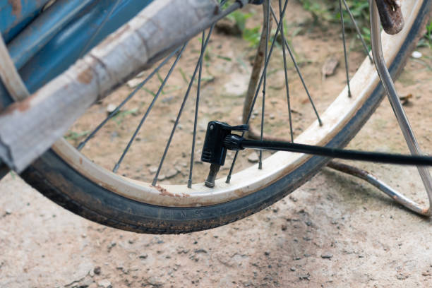 istock Bicycle air pump at the wheel rubber. 967910430