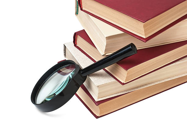 istock stack of books and magnifying glass 96791057
