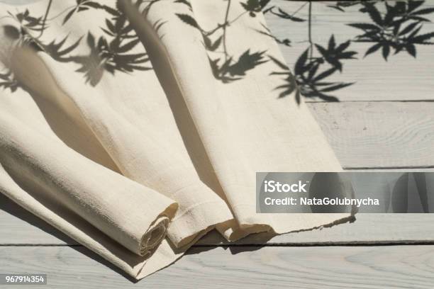 Hemp Fabric On A White Wooden Surface Stock Photo - Download Image Now - Hemp, Textile, Cannabis Plant