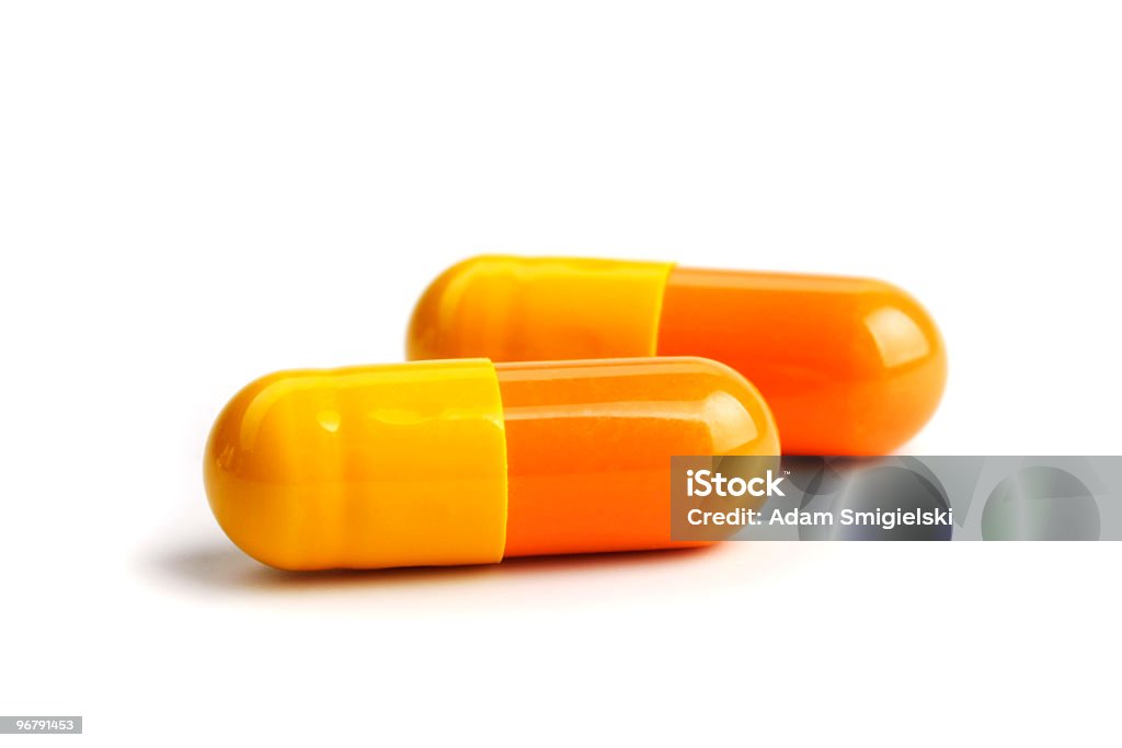 Amarillo anaranjado de cápsula - Foto de stock de Píldoras libre de derechos