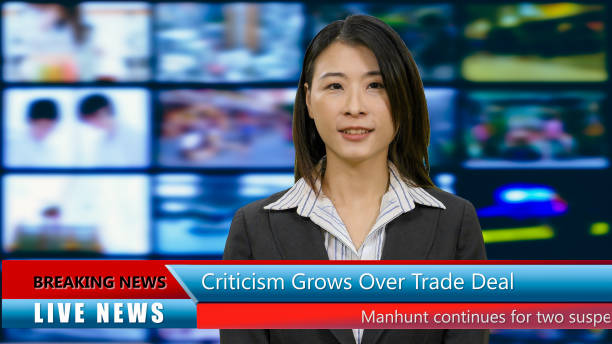 istock Asian American anchorwoman with lower thirds 967921388