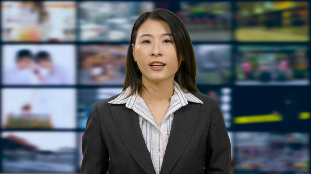 istock Asian anchorwoman in TV studio 967921472