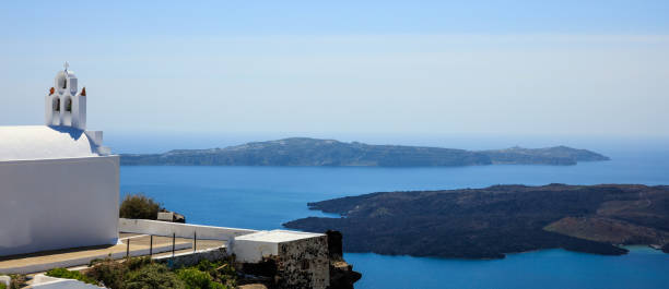 istock Santorini, Greece - White church and caldera view 967921590