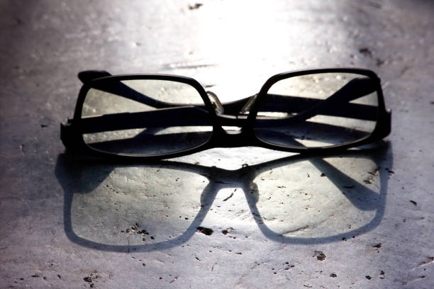 Glasses on the ground with sunlight ray from background