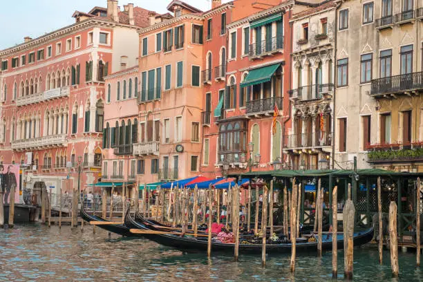 A gondola stand and colorful buildings on the Grand Canal, Venice