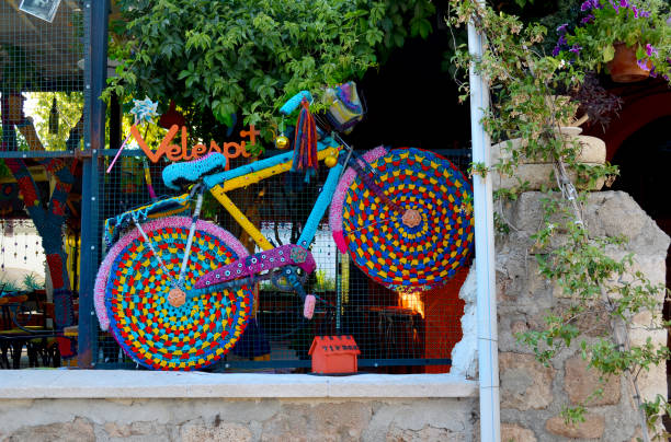 Antalya,Turkey, May 10,2018. Bright multicolored decorative bicycle in the window of a cafe.