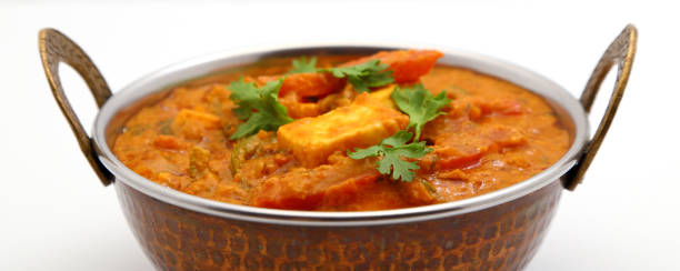 istock Indian Food or Indian Curry in a copper brass serving bowl. 967950632