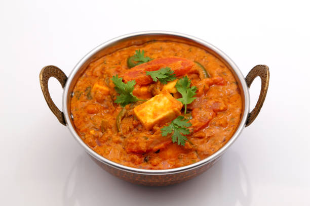 istock Indian Food or Indian Curry in a copper brass serving bowl. 967950762