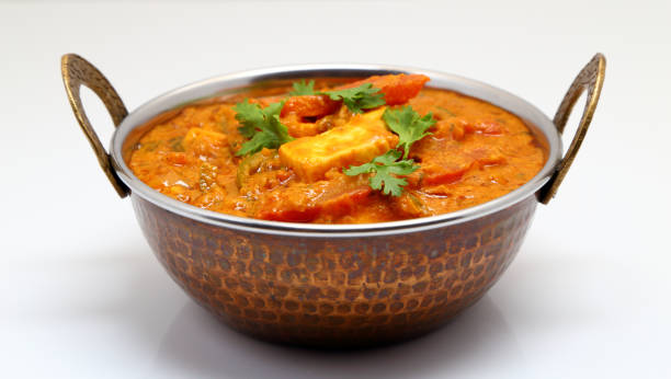 istock Indian Food or Indian Curry in a copper brass serving bowl. 967950802