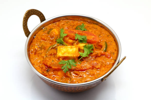istock Indian Food or Indian Curry in a copper brass serving bowl. 967950886
