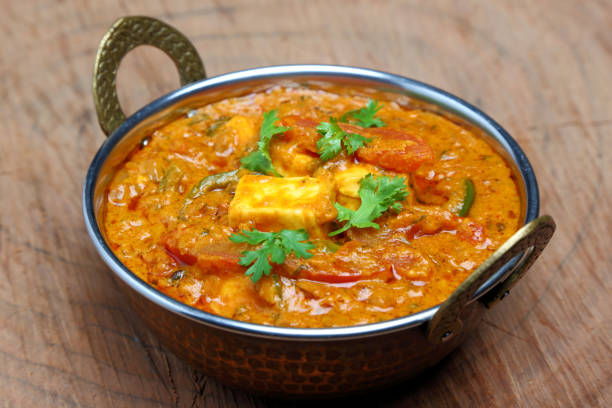istock Indian Food or Indian Curry in a copper brass serving bowl. 967950932