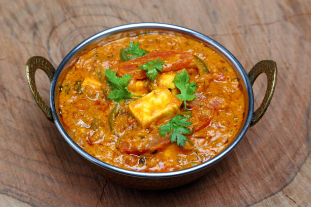 istock Indian Food or Indian Curry in a copper brass serving bowl. 967951002