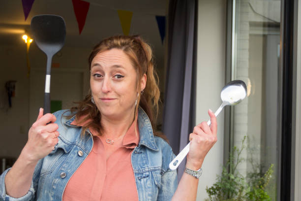 istock Lady serving paella at a home garden party 967961726