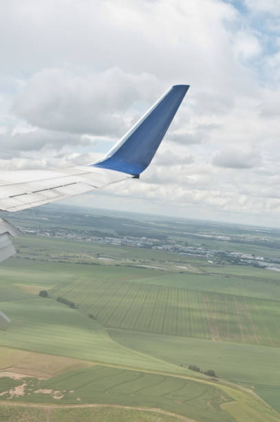 istock Aeroplane Engine & Wing Mid-Air - Airplane Landing Or Taking off 967983108