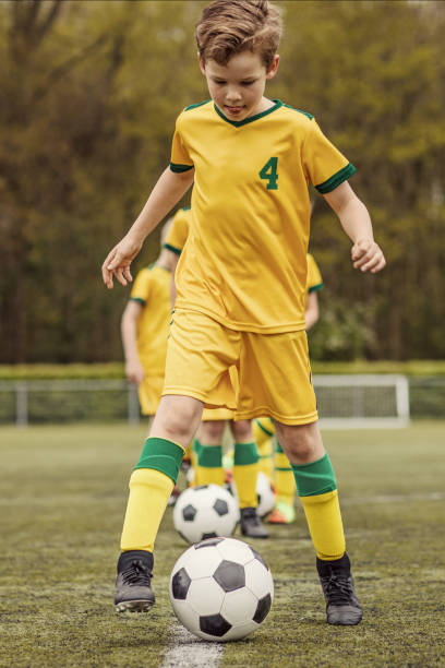 istock A boys soccer team during an intense football training session 967985188