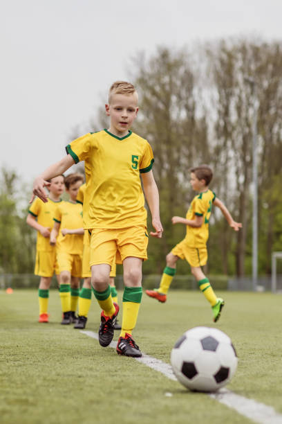 istock A boys soccer team during an intense football training session 967985312