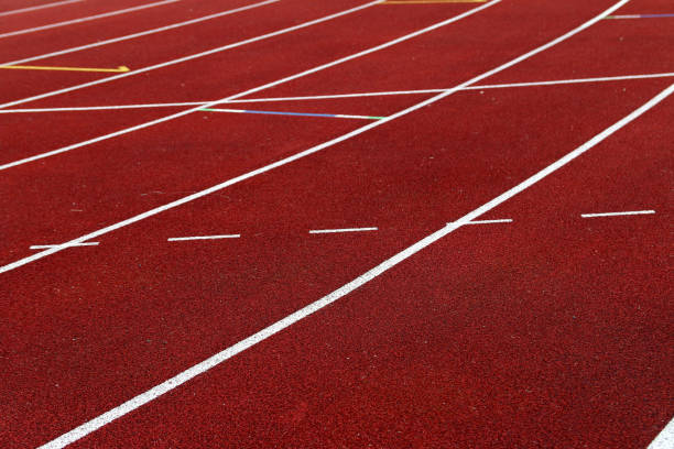 istock White lines marking the lines on an outdoor athletic track 967985464