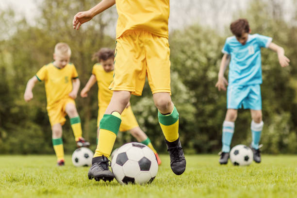 istock A boys soccer team during an intense football training session 967985654