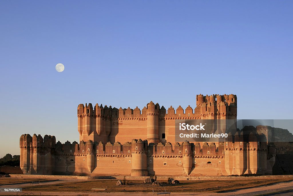 The fortress of Coca (Spain) at dusk with full moon  Castillo De Coca Stock Photo