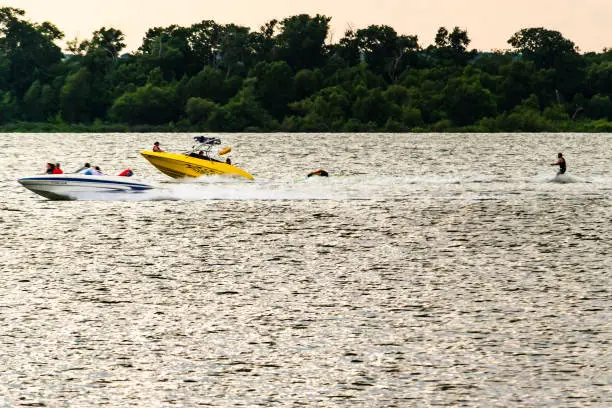 Yellow boat on Lake Cleburne, Texas on a beautiful sunny day.