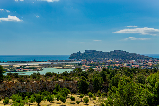 Panorama of Cagliari (Sardinia, Italy) and of the coast from the Park of Monte Urpinu on the city's hill in spring. In the background the promontory called Sella del Diavolo.