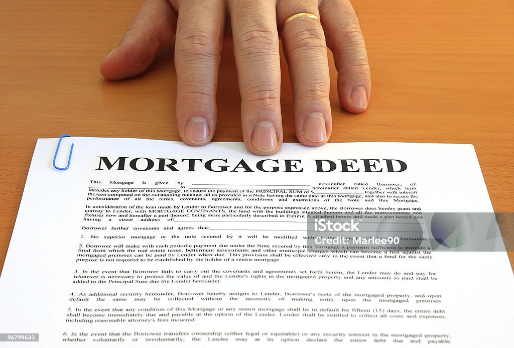 Mortgage Deed and Hand  Agreement Stock Photo