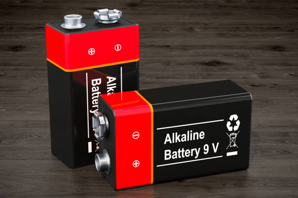 9V batteries on the wooden background, 3D rendering