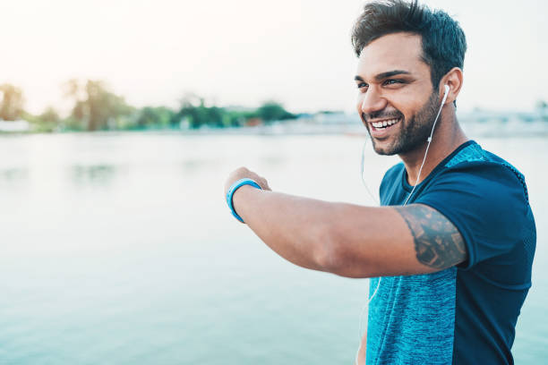 istock Smiling sportsman with smart watch 968003612