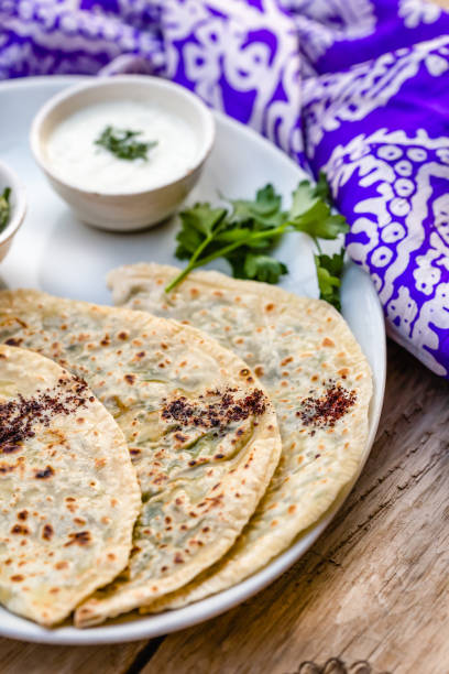 istock Azerbaijani traditional cuisine. Qutabs served with yogurt. 968005872
