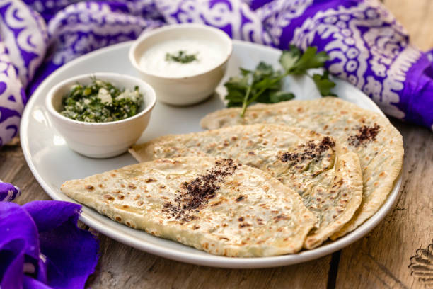 istock Azerbaijani traditional cuisine. Qutabs served with yogurt. 968005884