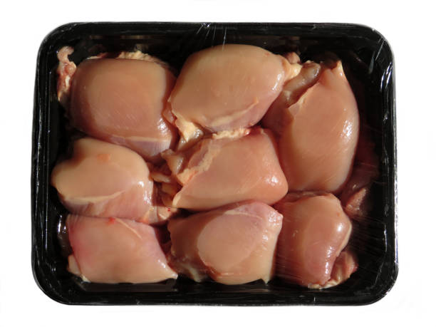 istock Unopened vacuum pack of raw chicken thighs without skin 968006662
