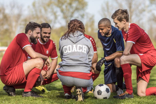 istock A soccer team looking at tactics on a tablet during a football training session 968008958