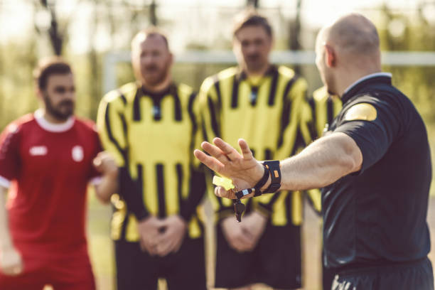 istock A soccer referee controlling the situation during a football match 968009044