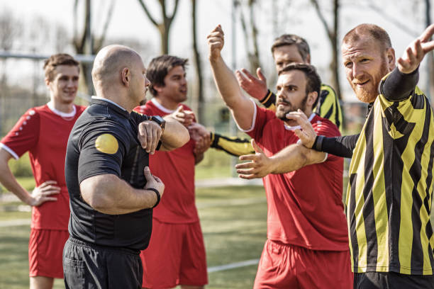 istock A soccer referee controlling the situation during a football match 968009288