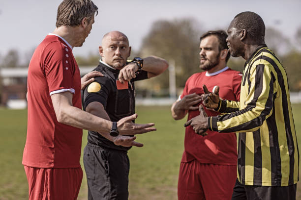 istock A soccer referee controlling the situation during a football match 968009342