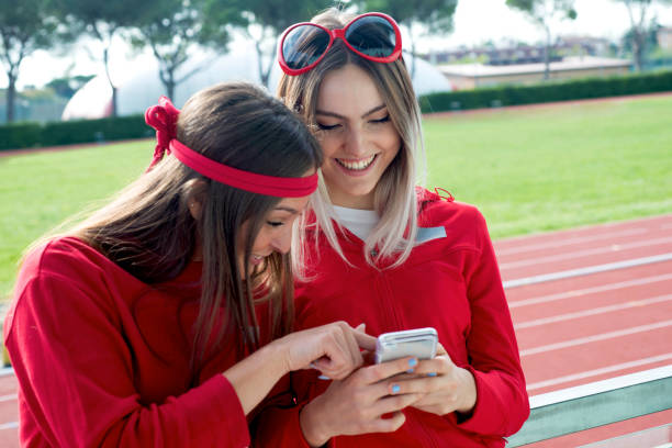 istock Two Girls looking the Smartphone 968011940