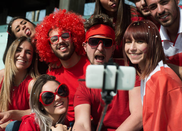 istock Group of Fans Taking a Selfie 968014086
