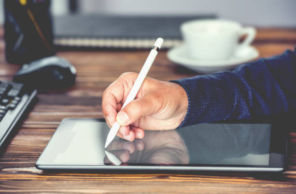 istock Digital Signature Concept with Tablet and Stylus Pen 968017074