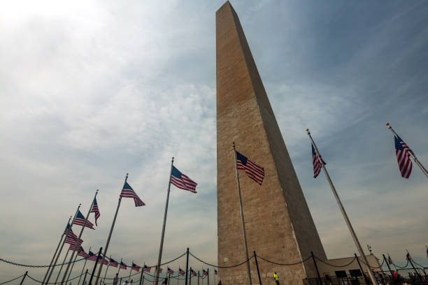 istock obelisk and american flag at washington 968025214