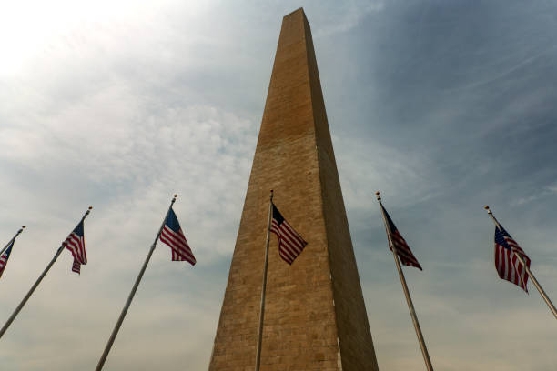 istock obelisk and american flag at washington 968025586
