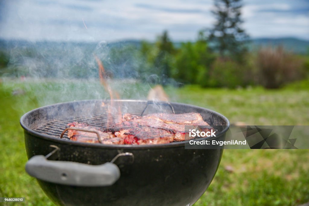 grilled meat outside Beef steaks on the grill. copy space for your text Barbecue Grill Stock Photo
