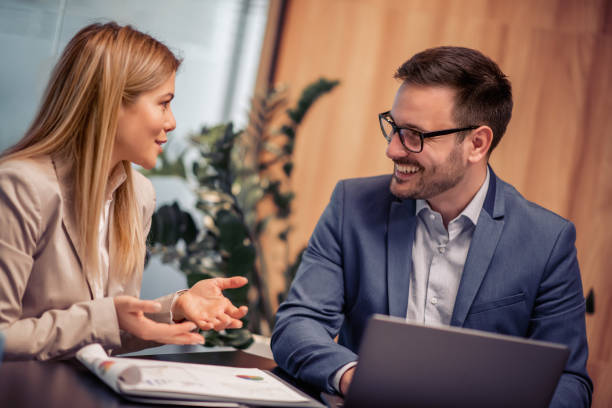 istock Two business colleagues working togethe 968028552