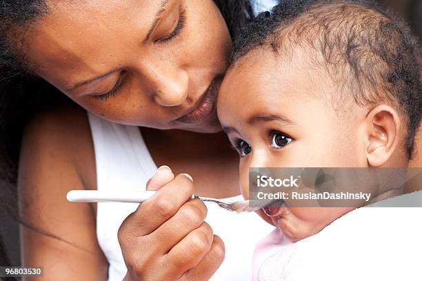 Mother Feeding Her Baby Stock Photo - Download Image Now - Baby - Human Age, Eating, Feeding