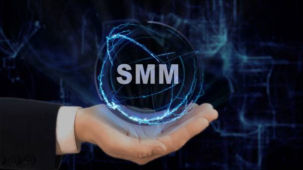 istock Painted hand shows concept hologram SMM on his hand 968050380